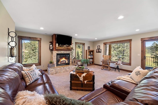 carpeted living room with a fireplace