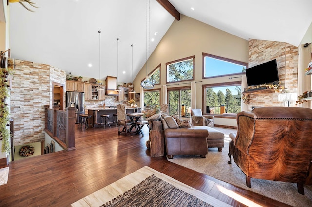 living room with beam ceiling, high vaulted ceiling, a fireplace, and dark hardwood / wood-style flooring