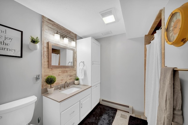 bathroom featuring walk in shower, vanity, toilet, and a baseboard heating unit