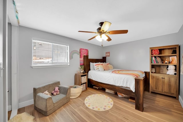 bedroom with wood-type flooring and ceiling fan