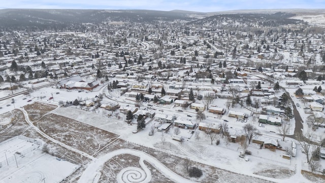 snowy aerial view with a mountain view