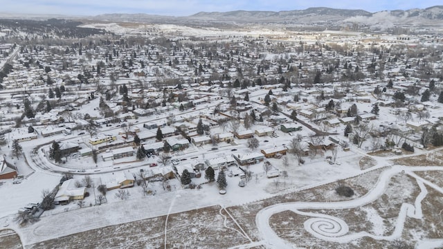 snowy aerial view with a mountain view