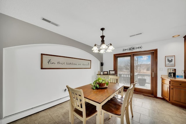 tiled dining space featuring a baseboard radiator and a chandelier