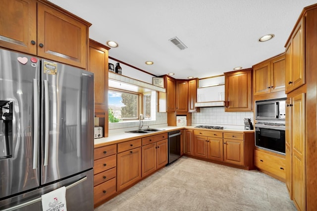 kitchen with sink, backsplash, and black appliances