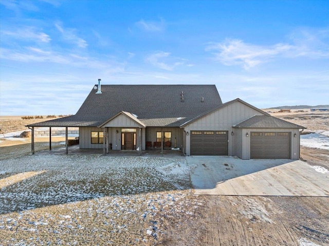 view of front facade with a garage and a carport