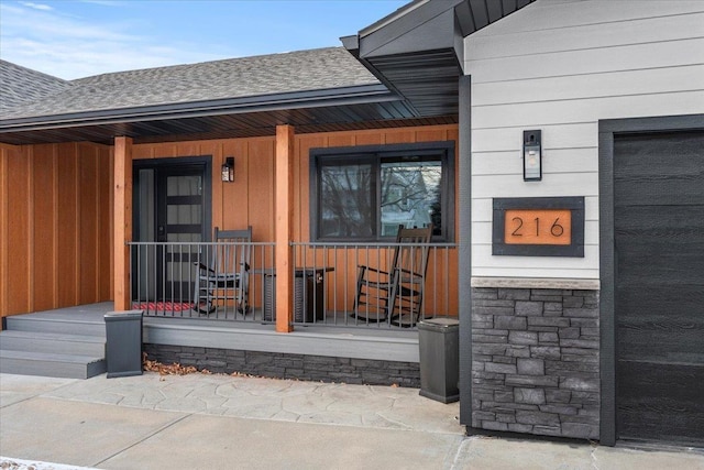 doorway to property featuring covered porch