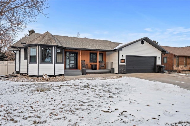 view of front facade featuring a garage and a porch