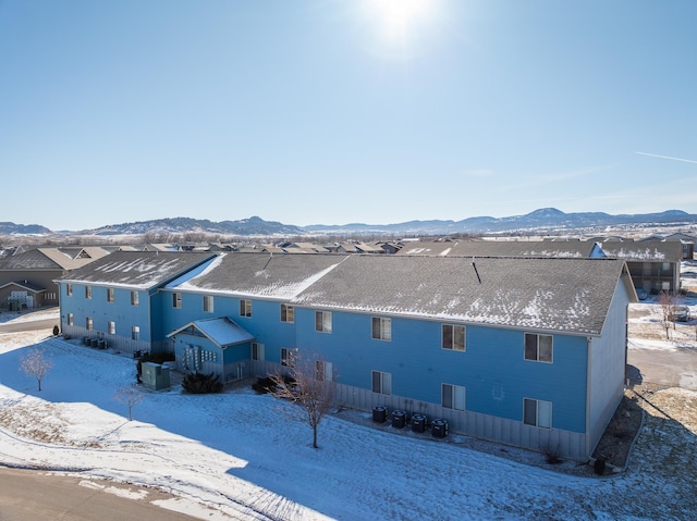 exterior space featuring central AC unit and a mountain view