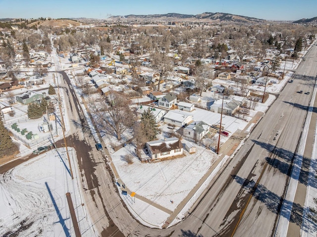 snowy aerial view with a mountain view