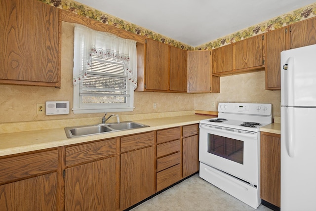 kitchen with sink and white appliances