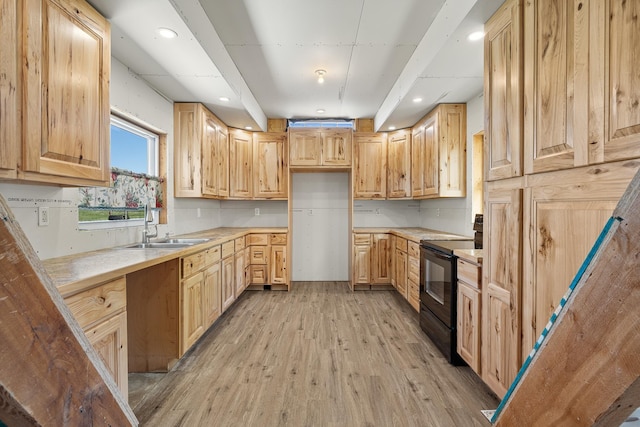 kitchen with black / electric stove, light brown cabinets, and light wood-type flooring