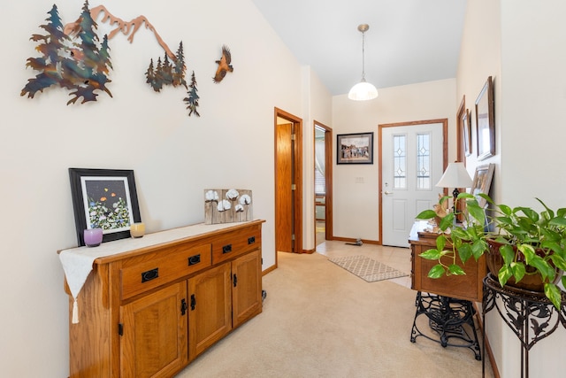 view of carpeted foyer