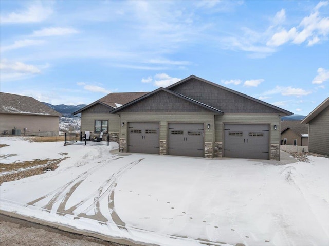 craftsman-style home with a mountain view and a garage