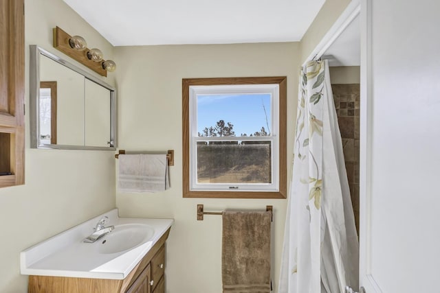 bathroom with vanity and a shower with shower curtain