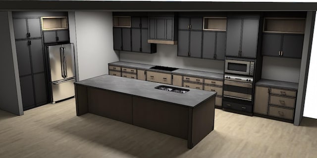 kitchen featuring light wood finished floors, appliances with stainless steel finishes, dark countertops, and a kitchen island