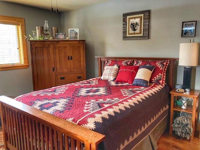 bedroom featuring wood finished floors