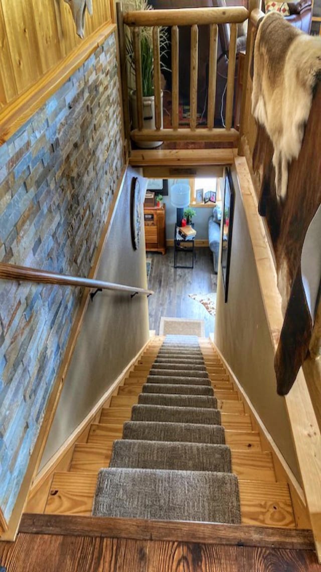 stairs with wood finished floors