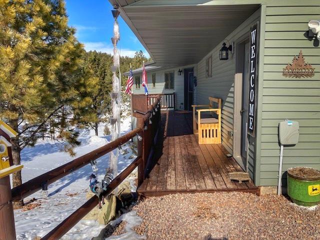 view of snow covered deck