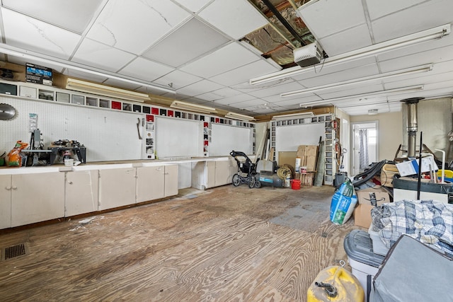 garage with visible vents and a garage door opener