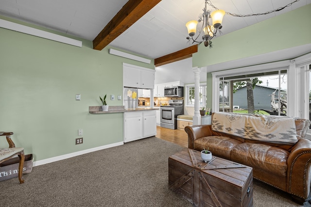 living room with baseboards, an inviting chandelier, carpet, ornate columns, and beam ceiling