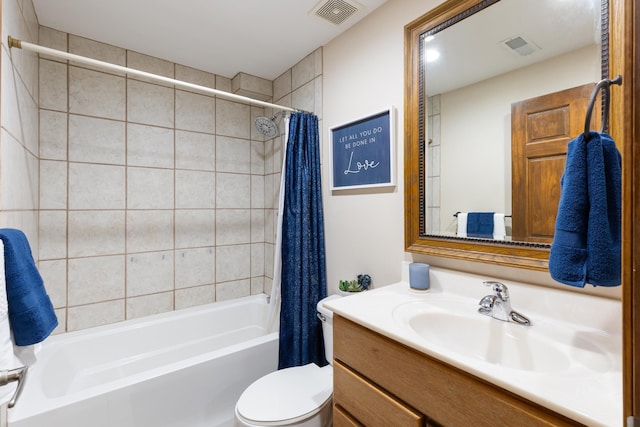 bathroom featuring toilet, shower / tub combo, visible vents, and vanity