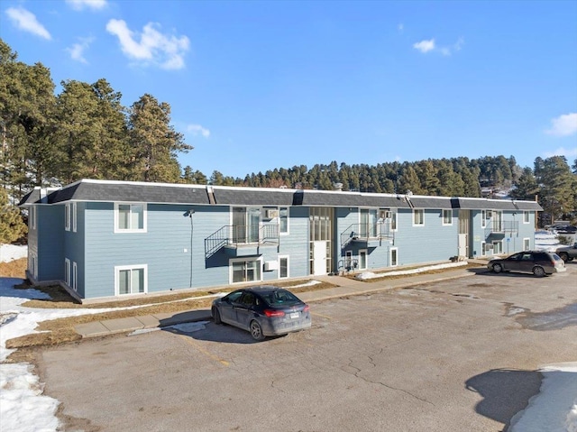 view of front of home featuring uncovered parking