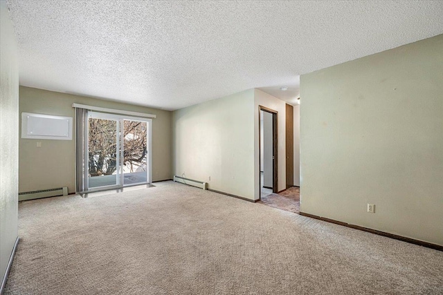 carpeted empty room featuring a baseboard radiator, a textured ceiling, and baseboards