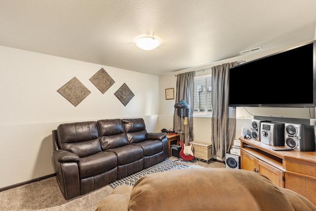 living room featuring light carpet, visible vents, baseboards, and a textured ceiling