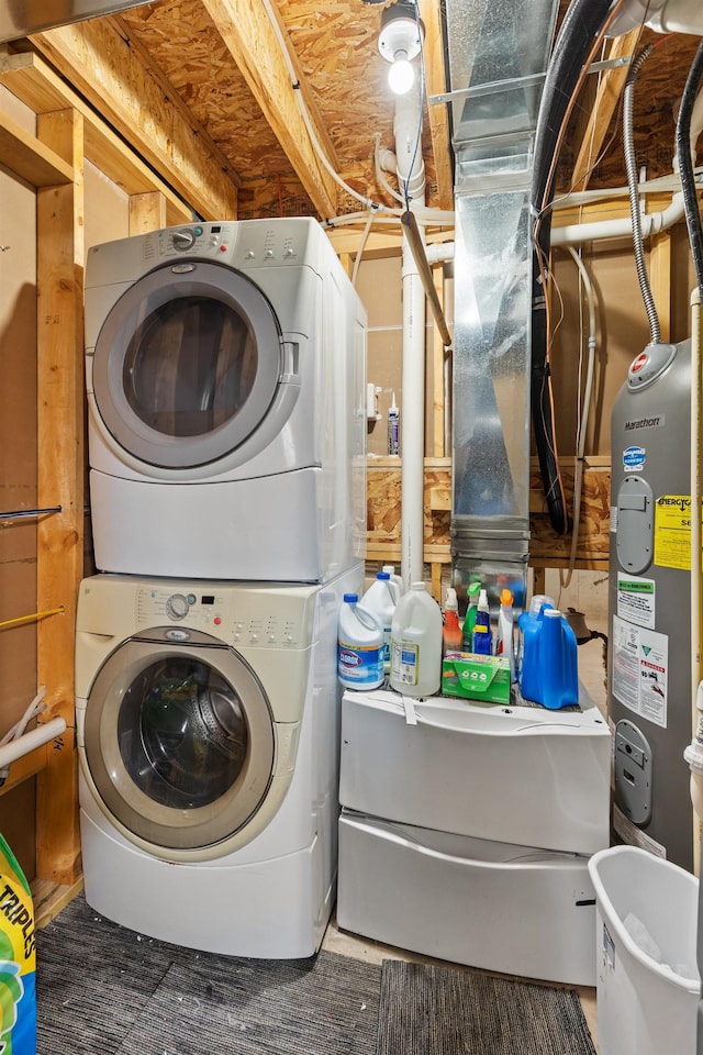 clothes washing area featuring stacked washer and dryer and laundry area