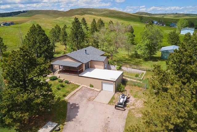 drone / aerial view featuring a rural view and a mountain view