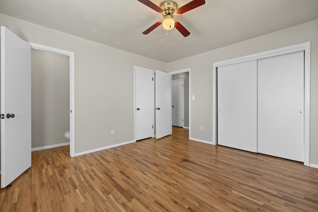 unfurnished bedroom featuring light wood-style floors, ceiling fan, and baseboards