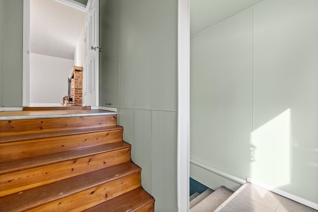 staircase featuring tile patterned floors