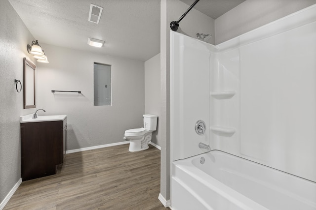 bathroom featuring electric panel, visible vents, wood finished floors, a textured ceiling, and vanity