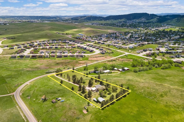 drone / aerial view with a residential view and a mountain view