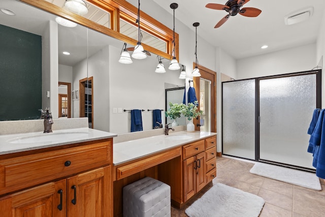 bathroom featuring a wealth of natural light, a stall shower, vanity, and tile patterned floors