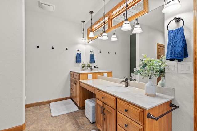 bathroom featuring vanity and baseboards