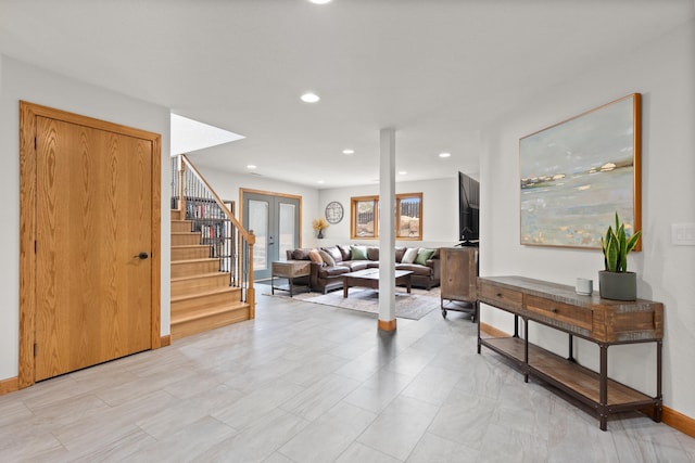 entrance foyer featuring recessed lighting, french doors, stairway, and baseboards