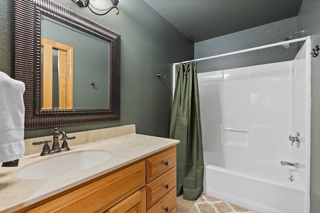 full bath with shower / bathtub combination with curtain, vanity, a textured ceiling, and a textured wall