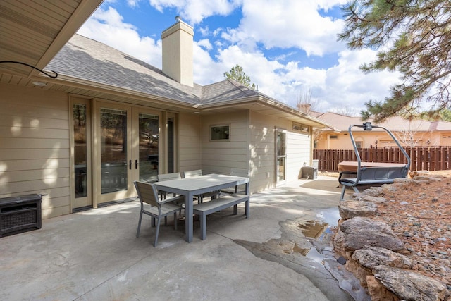 view of patio with fence and outdoor dining space