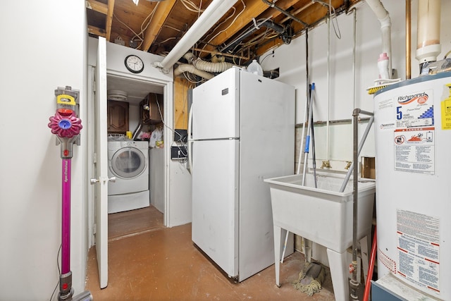 laundry area featuring laundry area, water heater, and washer / clothes dryer