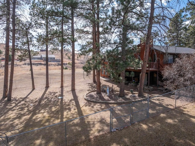 view of yard featuring fence private yard, a gate, and a wooden deck