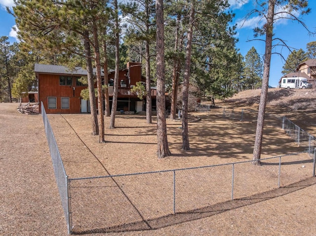 view of yard with fence and a wooden deck