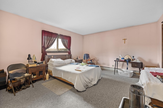 carpeted bedroom with a baseboard heating unit