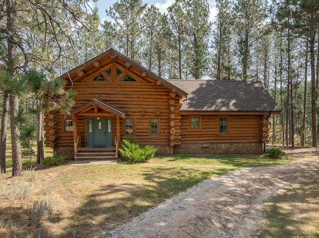 log cabin featuring a front yard, crawl space, roof with shingles, and log siding