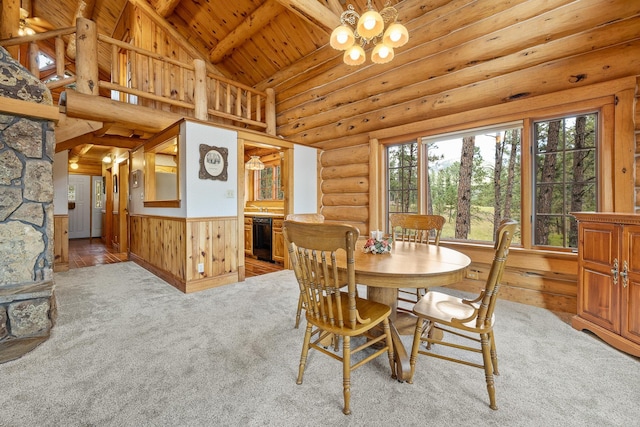 dining space featuring rustic walls, light colored carpet, lofted ceiling with beams, wooden ceiling, and an inviting chandelier