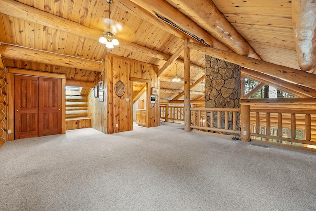 interior space featuring vaulted ceiling with beams, carpet floors, log walls, and wood ceiling