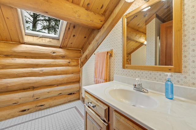 bathroom with wallpapered walls, a skylight, wooden ceiling, log walls, and vanity