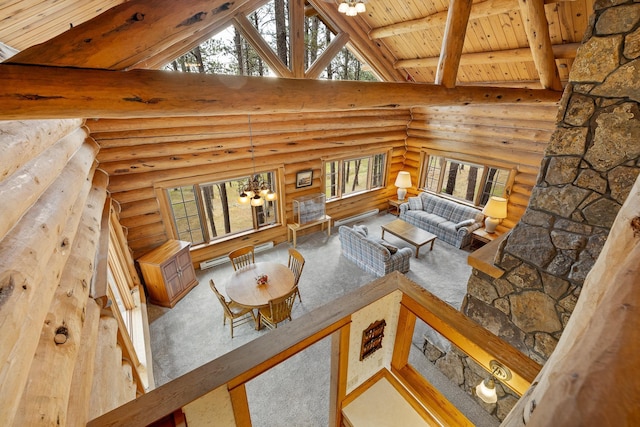 living area featuring wooden ceiling, an inviting chandelier, high vaulted ceiling, and beam ceiling