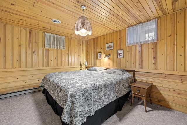 carpeted bedroom with wood walls, wooden ceiling, and visible vents