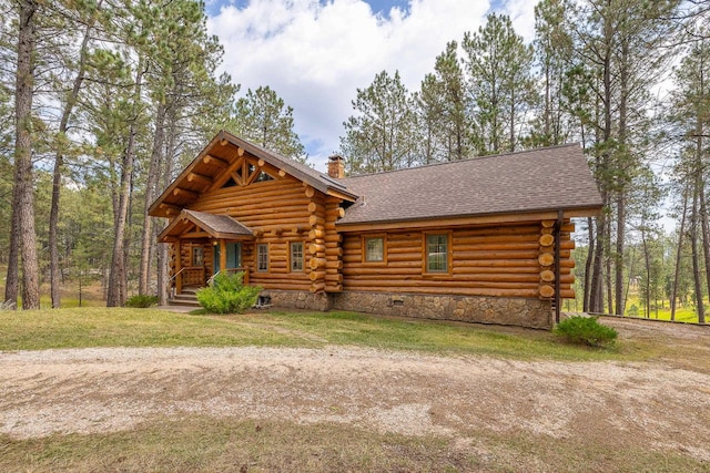 log home featuring a chimney, log siding, roof with shingles, crawl space, and a front yard